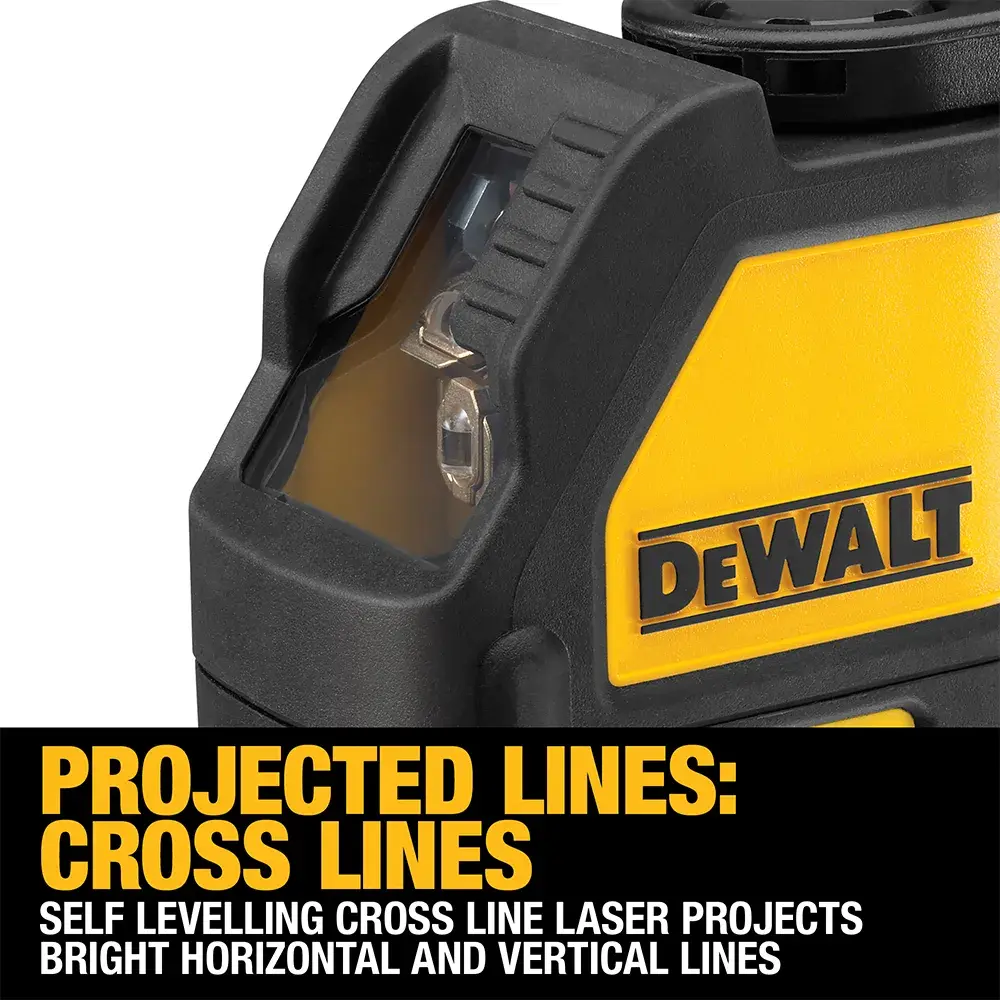 Un niveau laser vert DEWALT DW088CG est placé sur un sol en béton dans un chantier de construction. L'appareil projette une