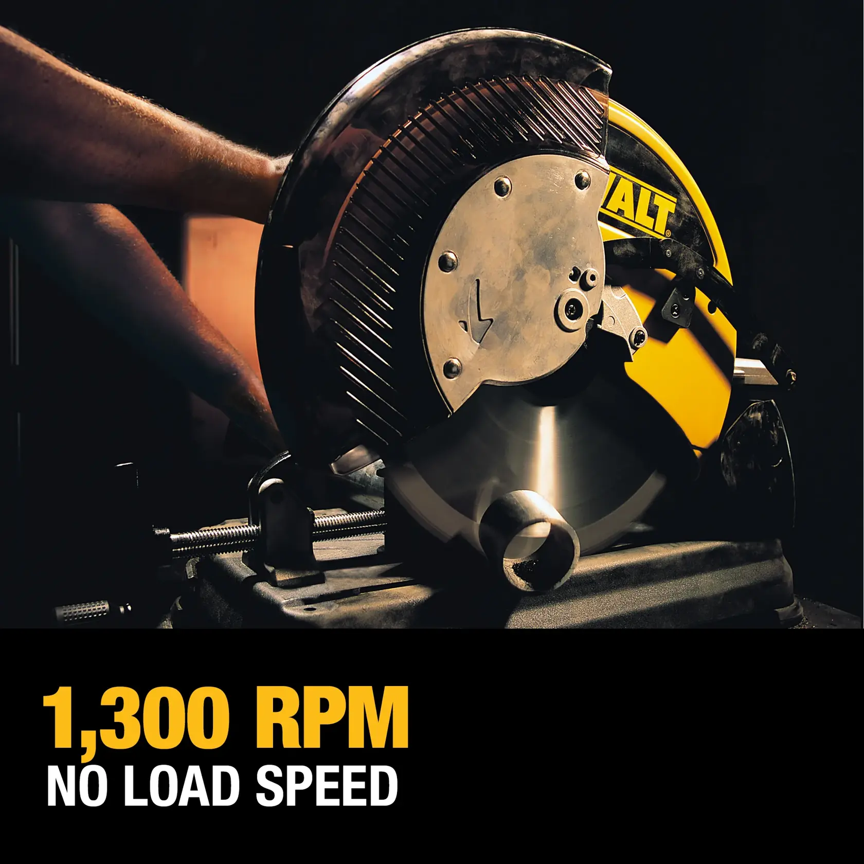 A DEWALT metal cutting saw in use, showing the blade spinning as it cuts through a metal pipe. The saw's yellow and black design is visible. The text below reads '1,300 RPM NO LOAD SPEED.'