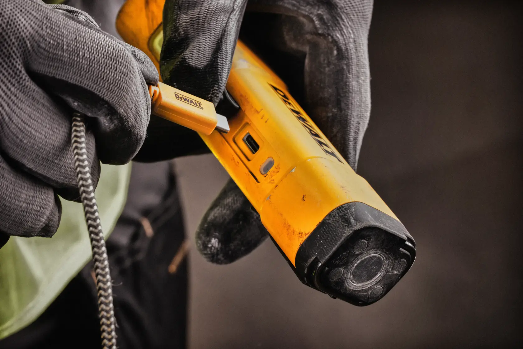 A yellow DEWALT DCL183 LED flashlight with a black clip and side button, designed for portable use.