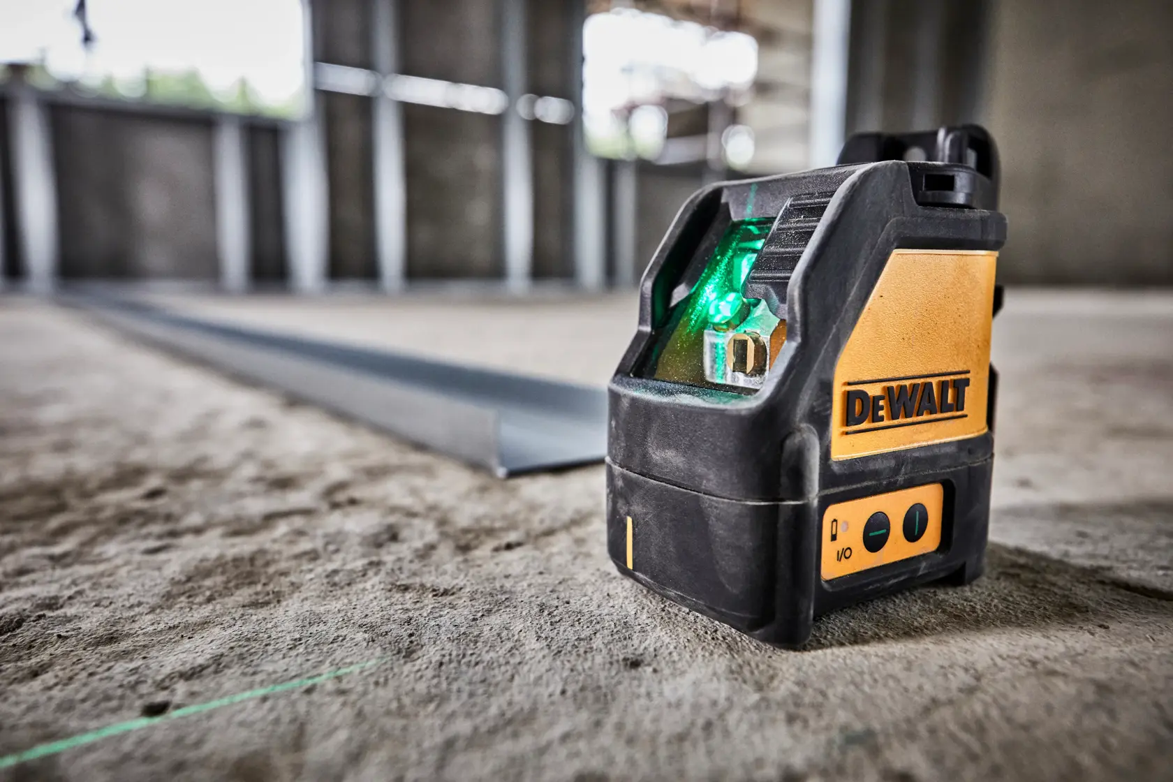 A DEWALT DW088CG green cross line laser level device with a yellow and black rugged casing, showing control buttons and the DEWALT logo on the side.