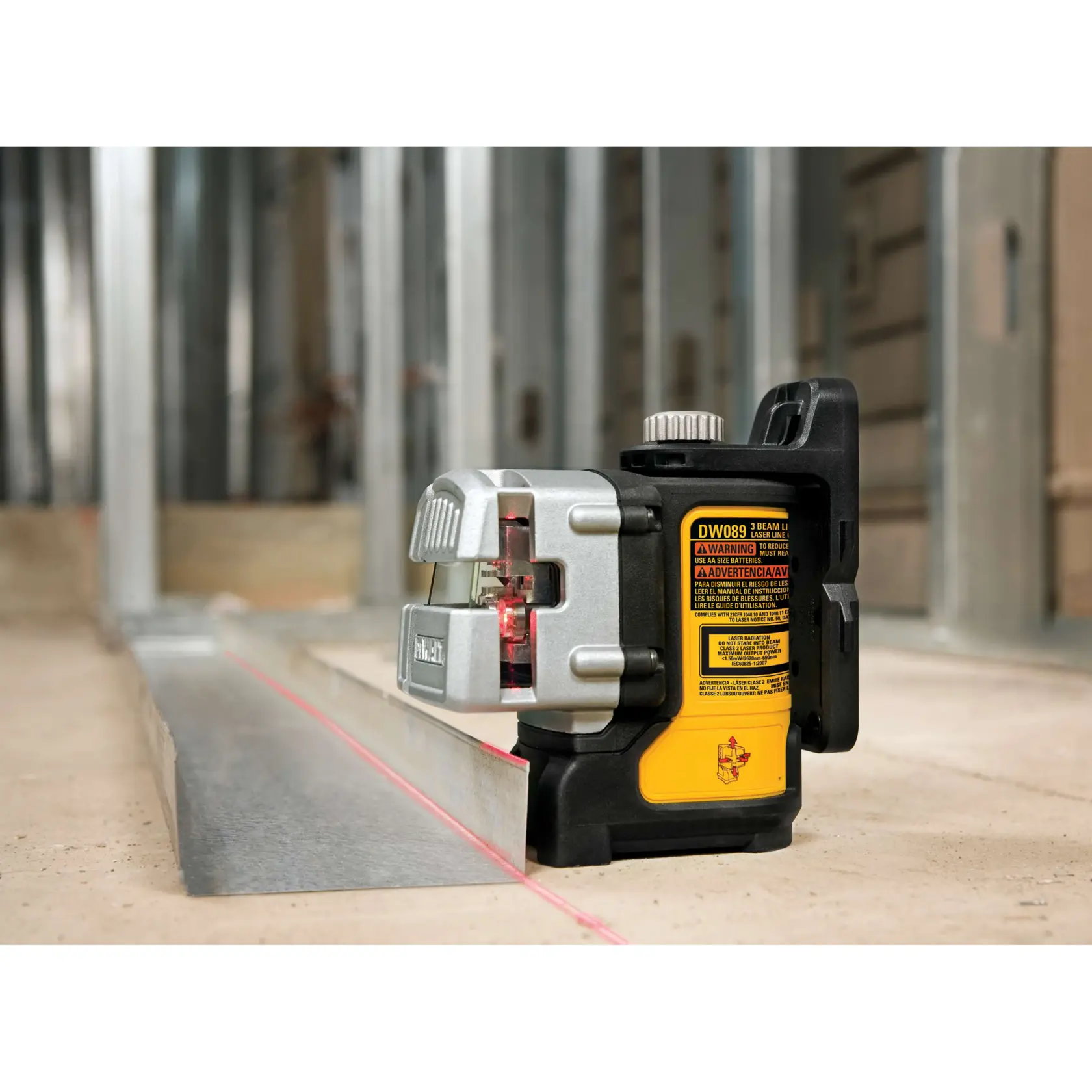 A DEWALT DW089K line laser kit including a laser measuring device, mounting bracket, and a hard carrying case with the DEWALT logo.