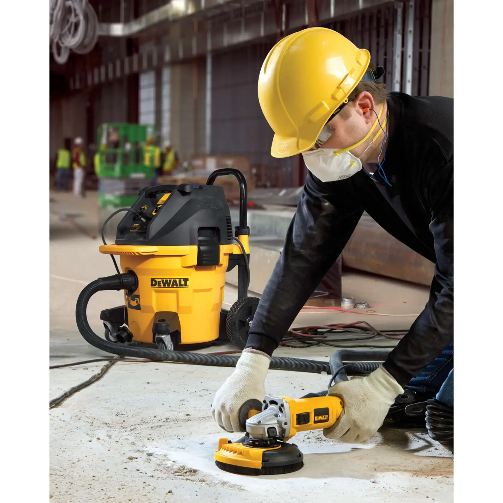 A DEWALT DWE46150 dust shroud attachment for an angle grinder, made of black and yellow plastic with labeling and a circular opening for fitting onto the tool.