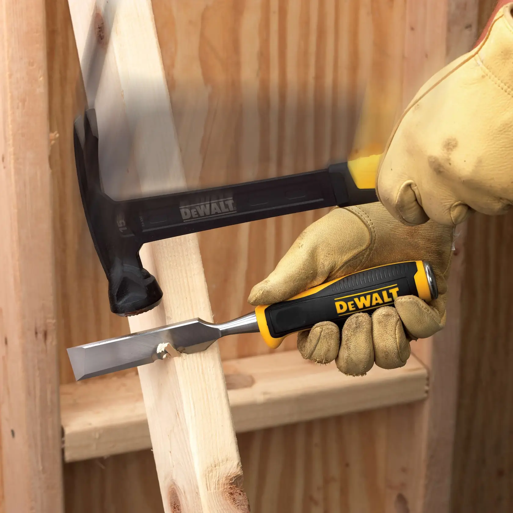 Close-up image of a DEWALT chisel with a large, textured metal strike surface. Text highlights 'Patented Strike Surface' in bold yellow letters, with a note stating 'Large strike surface for better durability.' The chisel is marked with '1" / 25 mm.'