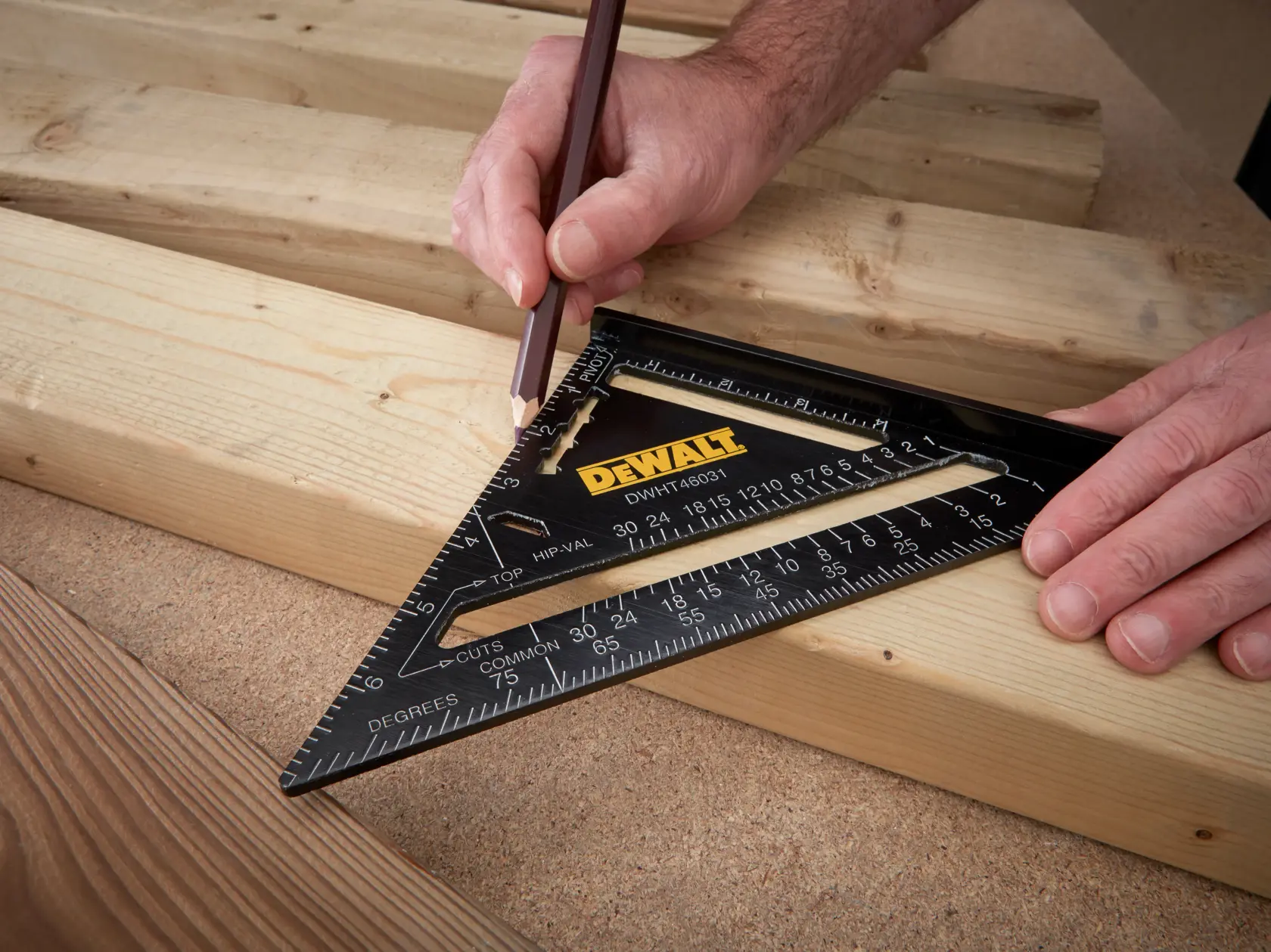 A DEWALT black triangular carpenter's square, featuring measurement markings, angle guides, and a common rafter conversion chart printed in white on its surface.